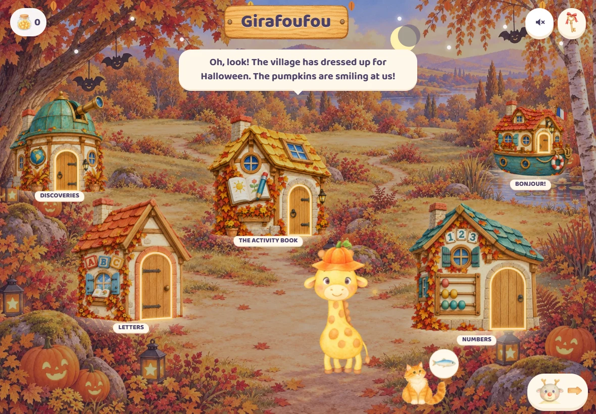 Girafoufou’s village in the game at Halloween: smiling pumpkins, paper bats in the tree, and Girafoufou wearing her pumpkin hat in front of the houses